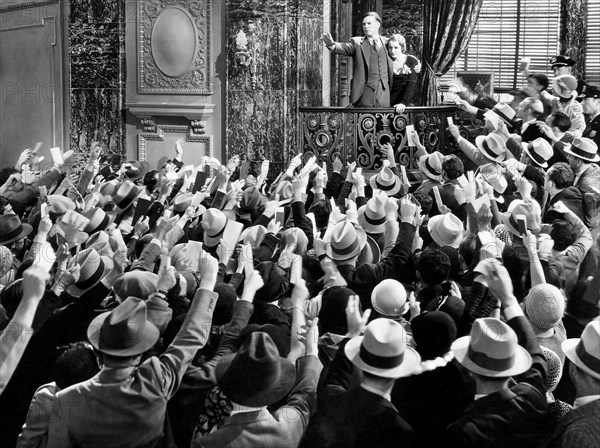 Walter Huston and Constance Cummings amongst Crowd, on-set of the Film, "American Madness", 1932