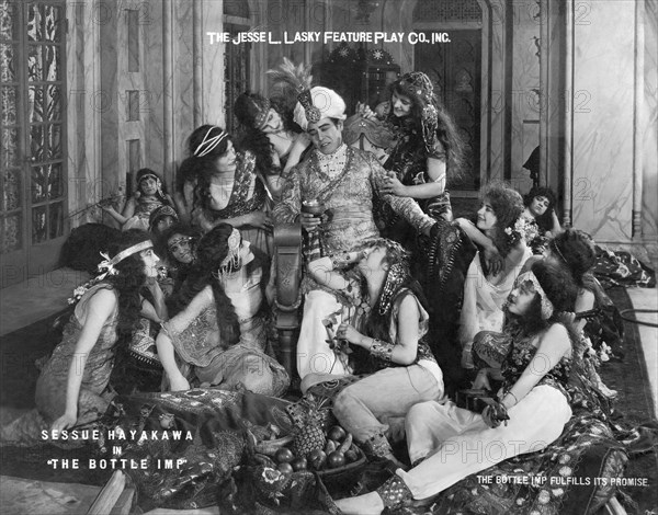 Sessue Hayakawa, surrounded by Group of Beautiful Women, on-set of the Silent Film, "The Bottle Imp", 1917