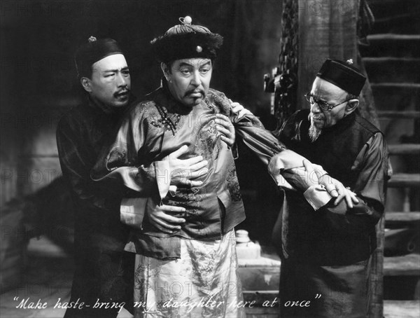 Sessue Hayakawa, (left), Warner Oland, (center), on-set of the Film, "Daughter of the Dragon", 1931