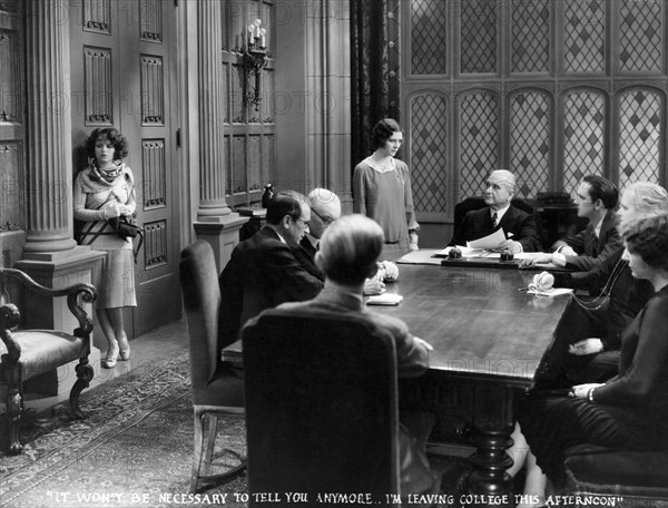 Clara Bow, (left), Shirley O'Hara, Fredric March, (seated, right), on-set of the Film "The Wild Party", 1929