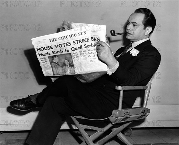 Edward G. Robinson, Portrait Reading Newspaper, circa 1943