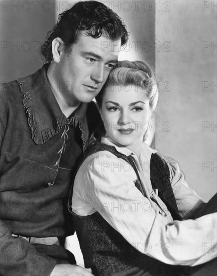 John Wayne, Claire Trevor, on-set of the Film "Allegheny Uprising", 1939