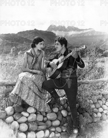 Mona Maris, Warner Baxter, on-set of the Film "The Arizona Kid", 1930