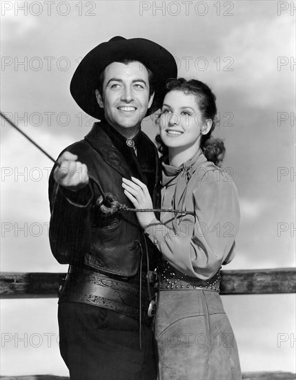 Robert Taylor, Mary Howard, on-set of the Film "Billy the Kid", 1941