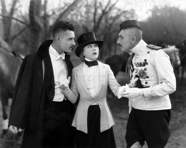 John Gilbert, (left), Mae Murray, on-set of the Silent Film "The Merry Widow", 1925