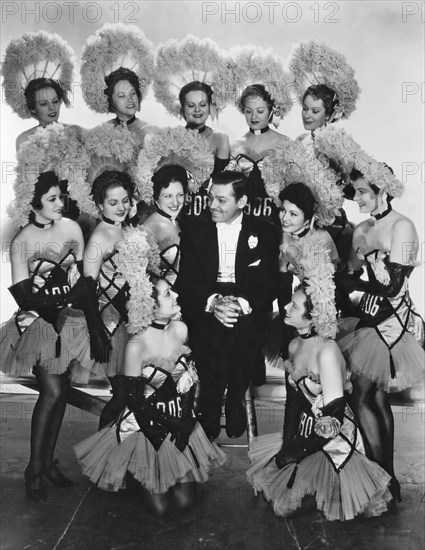 Clark Gable and chorus girls, on-set of the Film "San Francisco", 1936