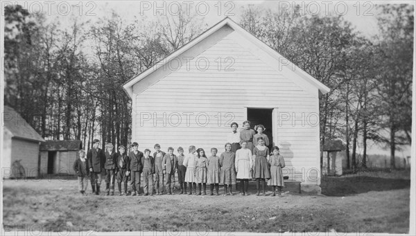 Teacher and Students in Front of One-Room School House, Portrait, USA, circa 1900