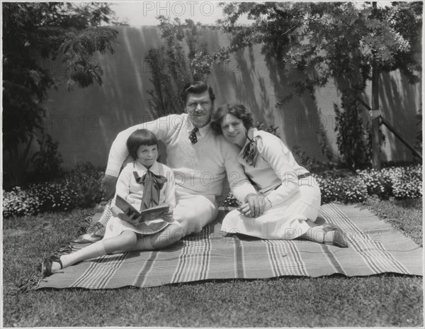 Actor George Bancroft, Portrait Sitting on Blanket with Wife Octavia Broske and Daughter Georgette, Santa Monica, California, USA, 1920's