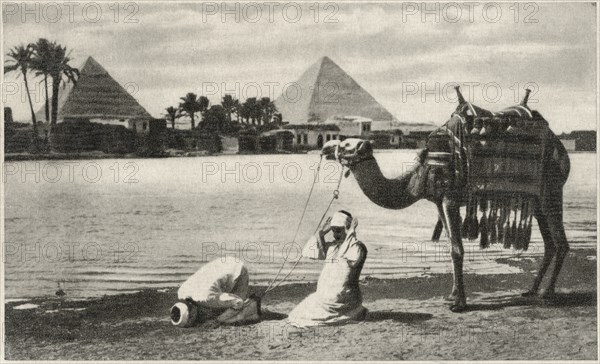 Morning Prayer along Nile River with Pyramids in Background, Cairo, Egypt, 1939