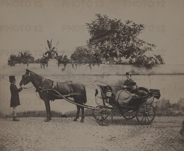 Portrait of Woman and Young Child Sitting in Horse-Drawn Carriage while Young Boy in Top Hat Stands at Front of Horse, Rome, Italy, 1900