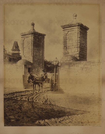 Portrait of Man Sitting in Horse-Drawn Cart at Street Entrance, Orange Street, Saint Augustine, Florida, USA, by George Baker, 1886