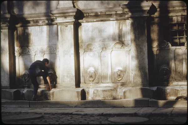 Man Washing his Feet before Entering Mosque, Istanbul, Turkey, 1963