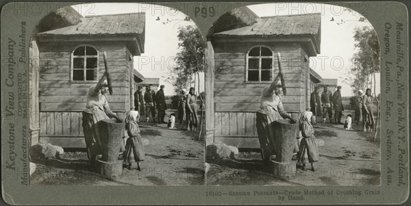 Russian Peasants-Crude Method of Crushing Grain by Hand, Stereo Card, Keystone View Company