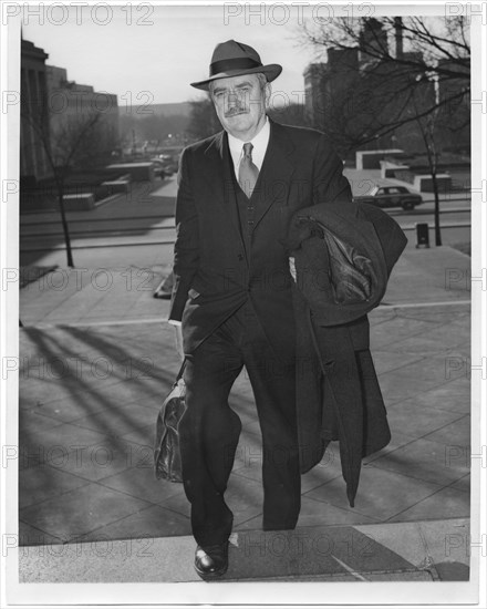 Earl Browder, former Communist Party General Secretary in the U.S., Arriving at U.S. District Court to Answer a Charge of Contempt of Congress for Refusal to Answer Questions of Investigating Committee, Washington DC, USA, December 1, 1950