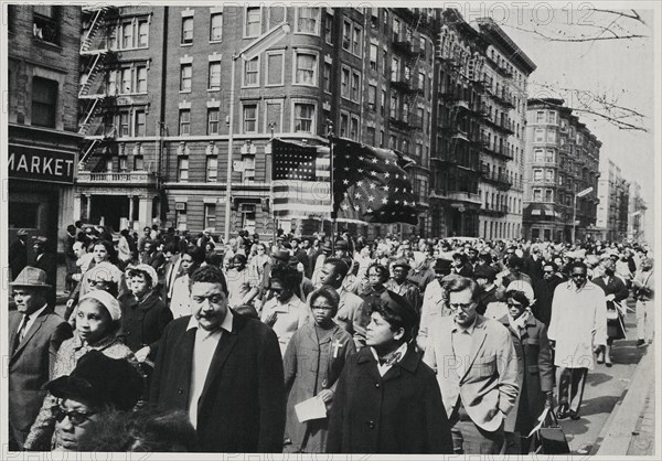Crowd of Mourners, some Carrying Flags, Marching down 7th Avenue near 112th Street on way to Attend Memorial Service for Dr. Martin Luther King Jr. in Central Park, New York City, New York, USA, April 7, 1968