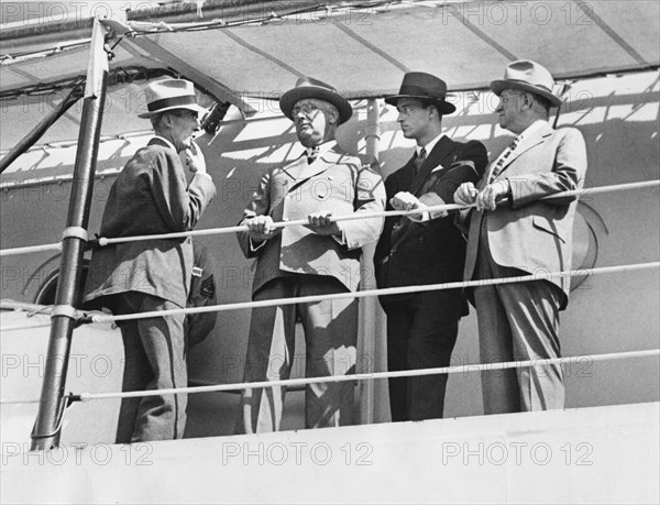 U.S. President Franklin Roosevelt (2nd Left) aboard USS Houston with (L-R) Assistant Secretary Marvin McIntyre, his son James Roosevelt and Secretary of the Interior Harold Ickes, upon Warship's Arrival in Charleston, South Carolina, USA, October 23, 1935