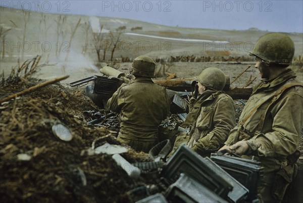 Firing a .30-caliber Machine Gun M1917A1 near Saarburg, Germany, Rhineland Campaign, 1945