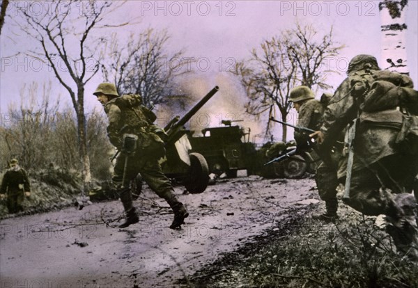 Enemy Troops Passing Burning U.S. Equipment, Ardennes-Alsace Campaign, Battle of the Bulge, 1945