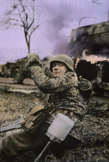 German Soldier Waving Members of his Unit Forward, Ardennes-Alsace Campaign, Battle of the Bulge, 1945