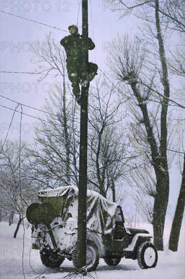 Signal Corps Lineman Repairing Damaged Telephone Lines, Ardennes-Alsace Campaign, Battle of the Bulge, 1945