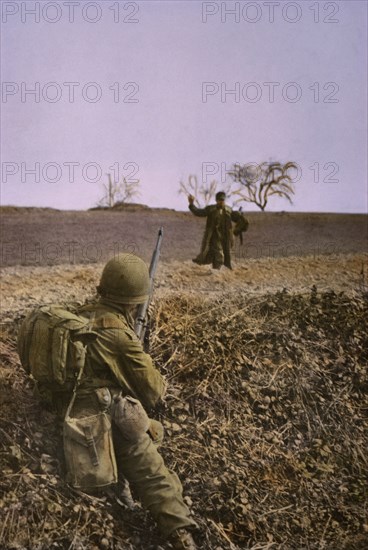 Infantryman Covering a German as he Surrenders, Central Europe Campaign, Western Allied Invasion of Germany, 1945