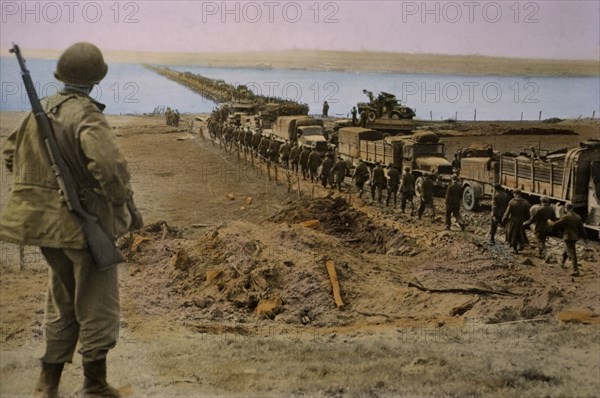 German Prisoners being Marched Westward Across Rhine as Troops of Ninth Army move into Germany, Central Europe Campaign, Western Allied Invasion of Germany, 1945