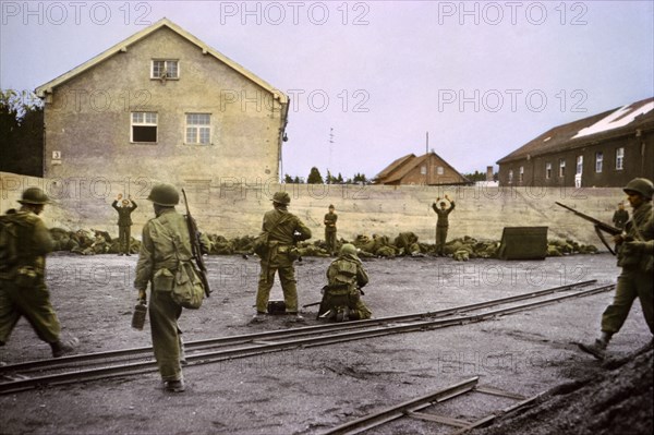 Capturing SS Guards in Coal Yard at Concentration Camp by 42nd Infantry Division, U.S. Seventh Army, Dachau, Germany, Central Europe Campaign, Western Allied Invasion of Germany, April 1945