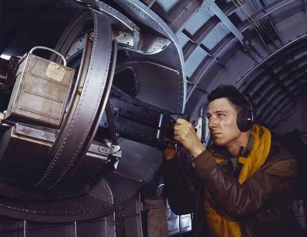 Man at Side Machine Gun of YB-17 Bomber, Langley Air Force Base, Hampton, Virginia, USA, Alfred T. Palmer for Office of War Information, May 1942