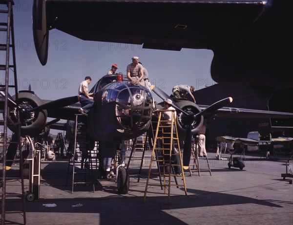 Employees on the "Sunshine" Assembly Line Putting Finishing Touches on B-25 Bomber, North American Aviation, Inc., Inglewood, California, USA, Alfred T Palmer for Office of War Information, October 1942