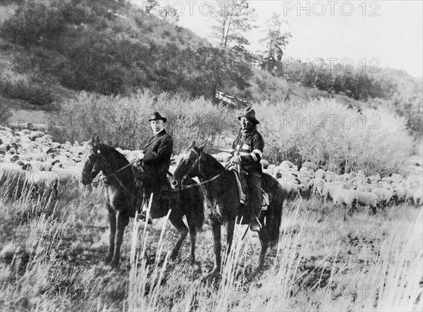 Ed Ladd, Full-Blood Apache Indian with Indian Commissioner Cato Sells, on Horseback, Jicarilla Reservation, New Mexico, USA, National Photo Company, 1910's