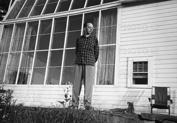 Composer Aaron Copland with his Pet Cat outside his House, Richmond, Massachusetts, USA, 1947