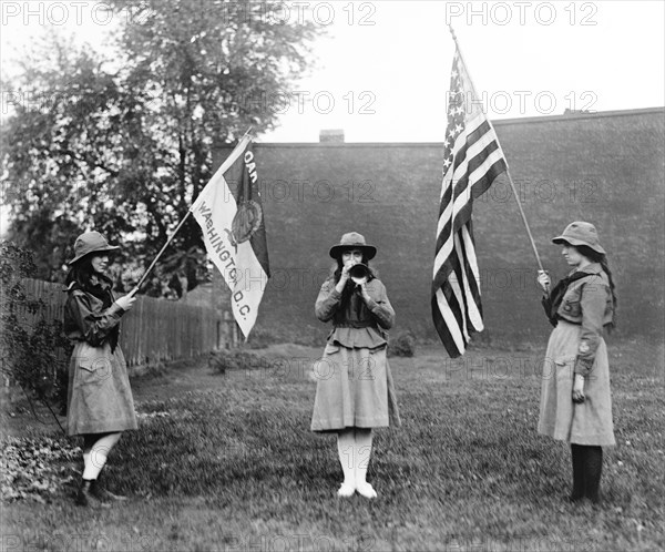 Three Girl Scouts, Two Holding Flags and one Playing Trumpet, Washington DC, USA, National Photo Company, 1920