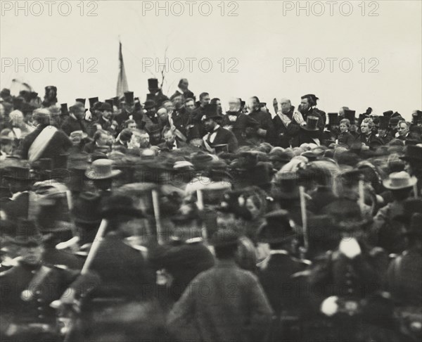 U.S. President Abraham Lincoln (without Hat below Flag slightly right) Standing Amongst Crowd during Dedication of Soldier's National Cemetery where he Delivered his Famous Speech, the Gettysburg Address, Gettysburg, Pennsylvania, USA, November 19, 1863