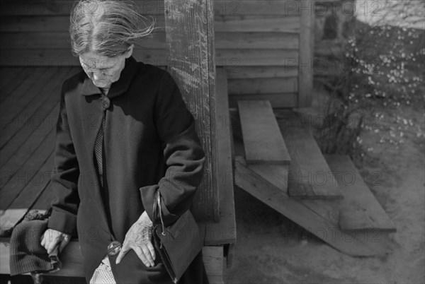 Depressed Woman sitting on Porch of Rural Home, near Whitestone, South Carolina, USA, Jack Delano, Farm Security Administration, March 1941