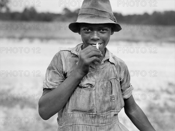 Half-length Portrait of Smiling Teenage Boy in Rural Setting, Florence County, South Carolina, USA, Farm Security Administration, 1938