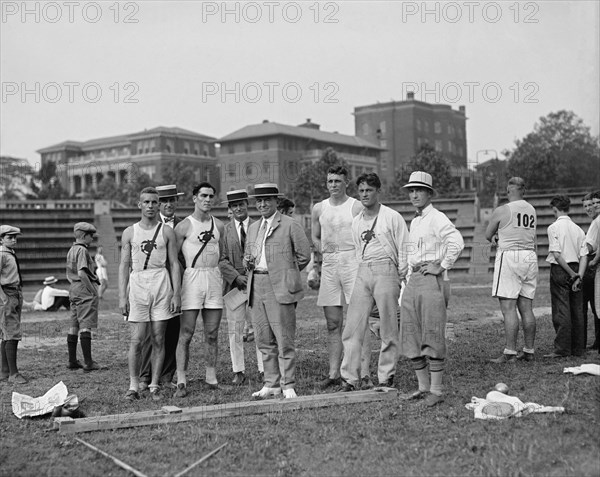 Shot Putter Harry S. Leversedge (standing third from right), USMC, Track & Field Meet, South Atlantic Champs, 1925