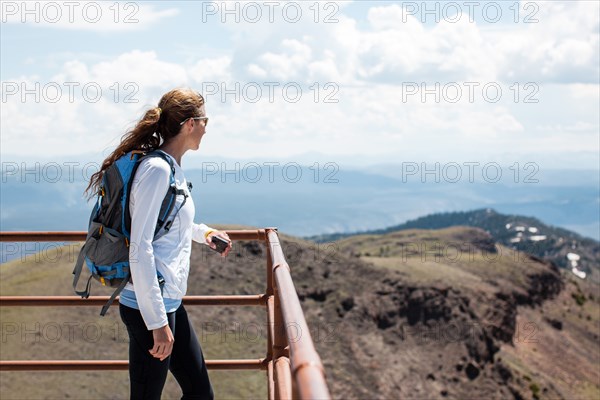 Hiker Viewing Mountain Landscape, Yellowstone National Park, Montana, USA