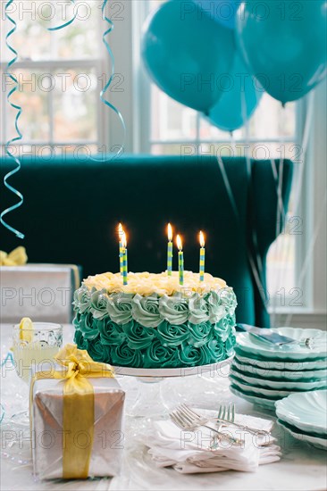 Blue Birthday Cake with Lit Candles