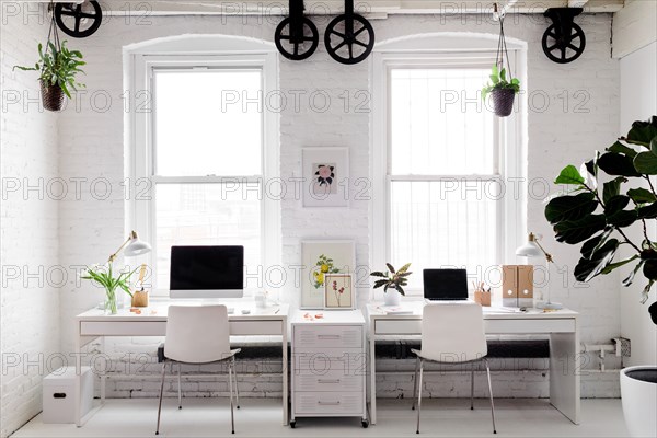 Monochromatic Modern Workplace with Floral Accents