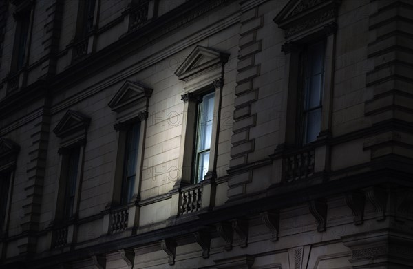 Spotlight on Exterior Window at Night