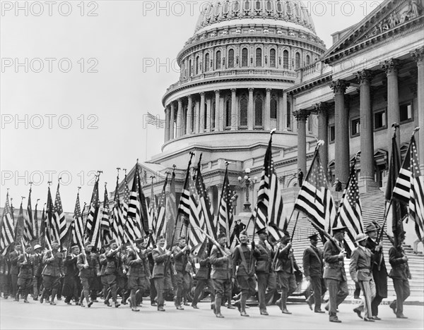 Bonus Expeditionary Forces, many Carrying American Flags, Marching across East Plaza of U.S. Capitol during Bonus Demonstration as Congress Struggled with Deficit, Washington DC, USA, Underwood and Underwood, April 8, 1932