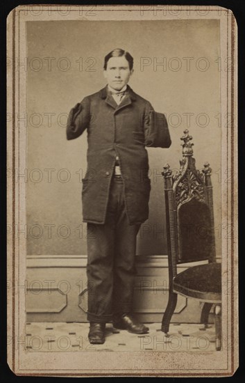 Richard D. Dunphy, former U.S. Navy Sailor with Amputated Arms, was Coal Heaver aboard USS Hartford during American Civil War and was Wounded during Battle of Mobile Bay, Awarded Congressional Medal of Honor, Full-length Standing Portrait, 1864