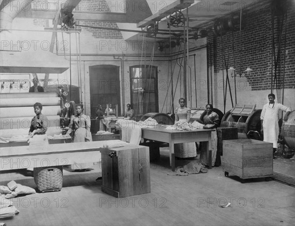 African American Women and Men near Machinery at Lexington Laundry, Richmond, Virginia, USA, 1900