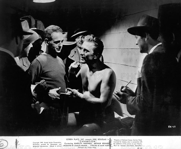 Actor Kirk Douglas (center), on-set of the Film, "Champion", United Artists, 1949