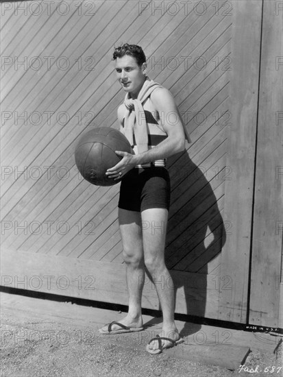Actor Richard Arlen, Publicity Portrait in Swimsuit Holding Medicine Ball, Paramount Pictures, 1931