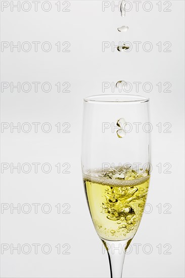Champagne Dropping into Glass