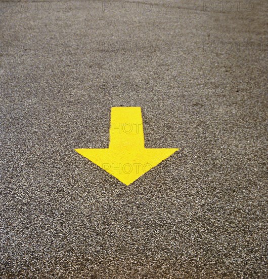 Yellow Arrow on Concrete