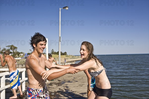 Playful Young Couple on Pier