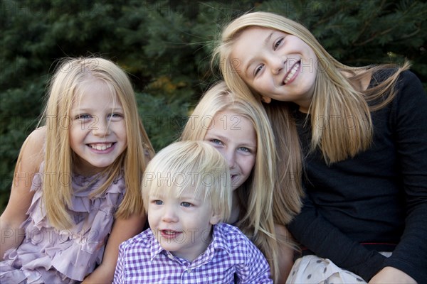 Four Smiling Siblings