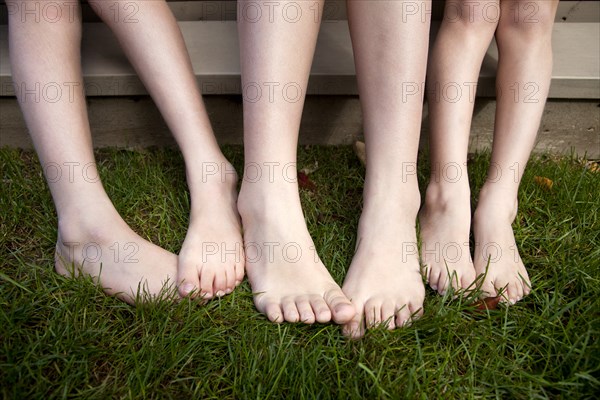 Three Pairs of Bare Legs